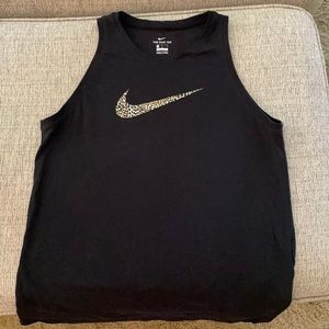 Nike sleeveless shirt. Swoosh has cheetah print.